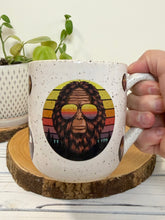 Load image into Gallery viewer, #010 - 18 oz. White speckled mug with Bigfoot heads *see notes