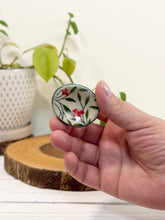 Load image into Gallery viewer, #040 - Red flower patterned Calming stone with green rim