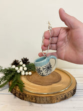 Load image into Gallery viewer, #020 - Mini pottery mug ornament with black snowflake pattern with light blue rim