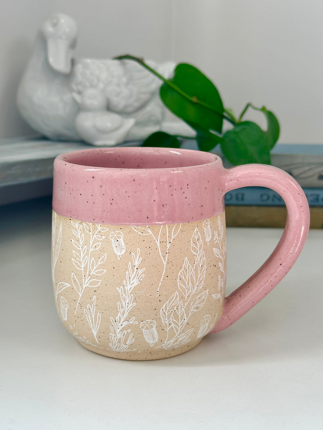 #012 - 18 oz. White floral pattern on bare clay, pink glazed rim and interior