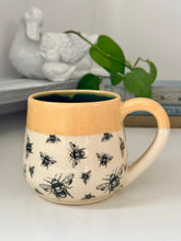 Load image into Gallery viewer, #014 - 16 oz. Bee mug with blue inside and honey rim
