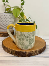 Load image into Gallery viewer, #002 - 16 oz. Green cactus patterned mug with blue inside and yellow rim
