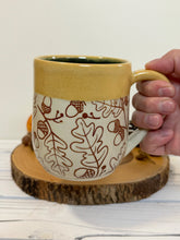 Load image into Gallery viewer, #009 -  16 oz. Brown acorn pattern mug with yellow rim and blue inside
