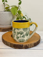Load image into Gallery viewer, #003 - 16 oz. Green ginkgo patterned mug with blue inside and yellow rim
