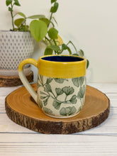 Load image into Gallery viewer, #003 - 16 oz. Green ginkgo patterned mug with blue inside and yellow rim
