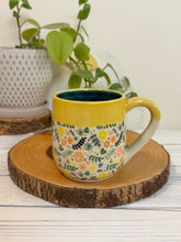 Load image into Gallery viewer, #004 - 14 oz. Coloured floral patterned mug with green inside and yellow rim
