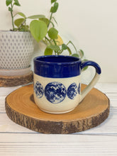 Load image into Gallery viewer, #008 - 16 oz. Blue moon phase patterned mug with cobalt blue rim
