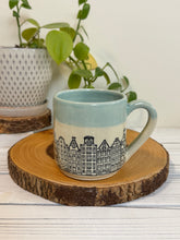 Load image into Gallery viewer, #019 - 16 oz. Amsterdam house patterned mug with aqua rim
