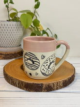 Load image into Gallery viewer, #022 - 16 oz. Doughnut and heart patterned mug with pink rim
