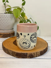 Load image into Gallery viewer, #022 - 16 oz. Doughnut and heart patterned mug with pink rim
