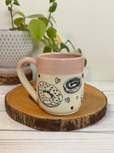 Load image into Gallery viewer, #022 - 16 oz. Doughnut and heart patterned mug with pink rim
