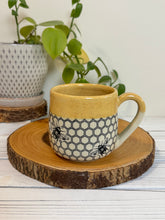 Load image into Gallery viewer, #023 - 16 oz. Honeycomb and bee patterned mug with honey coloured rim
