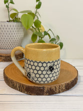 Load image into Gallery viewer, #023 - 16 oz. Honeycomb and bee patterned mug with honey coloured rim
