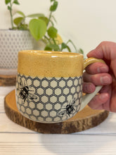 Load image into Gallery viewer, #023 - 16 oz. Honeycomb and bee patterned mug with honey coloured rim
