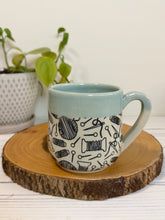 Load image into Gallery viewer, #001 - 16 oz. Yarn patterned mug with aqua rim and inside
