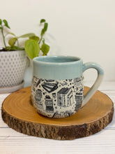 Load image into Gallery viewer, #003 - 16 oz. Book patterned mug with aqua rim and inside
