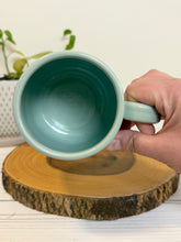 Load image into Gallery viewer, #003 - 16 oz. Book patterned mug with aqua rim and inside
