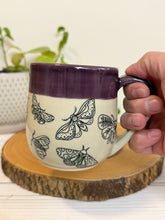 Load image into Gallery viewer, #006 - 16 oz. Moth patterned mug with purple rim and inside
