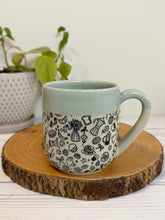 Load image into Gallery viewer, #011 - 16 oz. Coffee and breakfast patterned mug with aqua rim and inside
