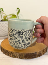 Load image into Gallery viewer, #011 - 16 oz. Coffee and breakfast patterned mug with aqua rim and inside
