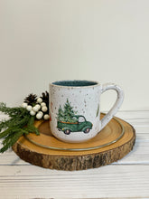 Load image into Gallery viewer, #020 - 14 oz. Christmas green truck pattern on White speckled mug with variegated blue inside
