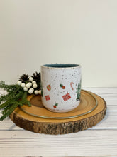 Load image into Gallery viewer, #020 - 14 oz. Christmas green truck pattern on White speckled mug with variegated blue inside
