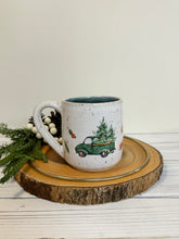 Load image into Gallery viewer, #020 - 14 oz. Christmas green truck pattern on White speckled mug with variegated blue inside
