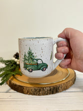 Load image into Gallery viewer, #020 - 14 oz. Christmas green truck pattern on White speckled mug with variegated blue inside
