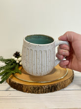 Load image into Gallery viewer, #029 - 16 oz. White speckled carved mug with green inside
