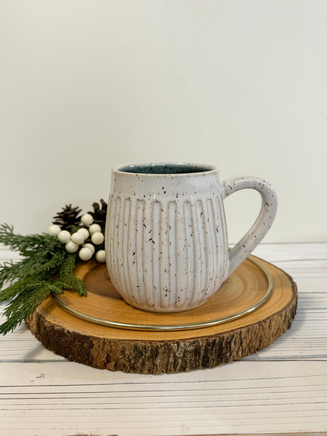 #031 - 18 oz. White speckled carved mug with blue inside