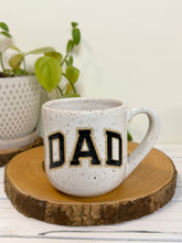 Load image into Gallery viewer, #006 - 16 oz. White speckled mug with black DAD
