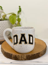 Load image into Gallery viewer, #006 - 16 oz. White speckled mug with black DAD
