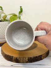 Load image into Gallery viewer, #007 - 16 oz. White speckled mug with Bigfoot drinking coffee
