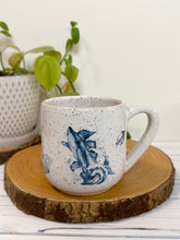 Load image into Gallery viewer, #021 - 16 oz. White speckled mug with whales and shells

