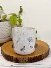 Load image into Gallery viewer, #022 - 16 oz. White speckled mug with whales and shells
