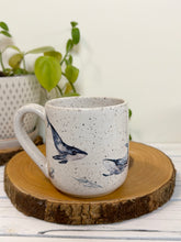 Load image into Gallery viewer, #023 - 16 oz. White speckled mug with whales and shells
