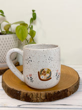 Load image into Gallery viewer, #026 - 16 oz. White speckled mug with snails
