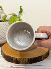 Load image into Gallery viewer, #028 - 14 oz. White speckled mug with watering can and flowers

