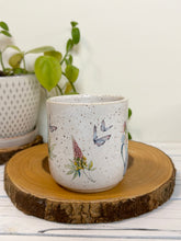 Load image into Gallery viewer, #029 - 16 oz. White speckled mug with watering can and flowers
