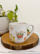 Load image into Gallery viewer, #030 - 16 oz. White speckled mug with gardening designs
