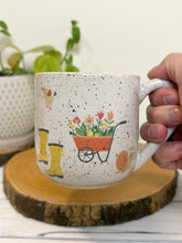 Load image into Gallery viewer, #030 - 16 oz. White speckled mug with gardening designs
