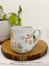 Load image into Gallery viewer, #031 - 16 oz. White speckled mug with gardening designs
