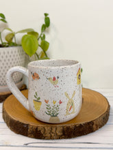 Load image into Gallery viewer, #031 - 16 oz. White speckled mug with gardening designs
