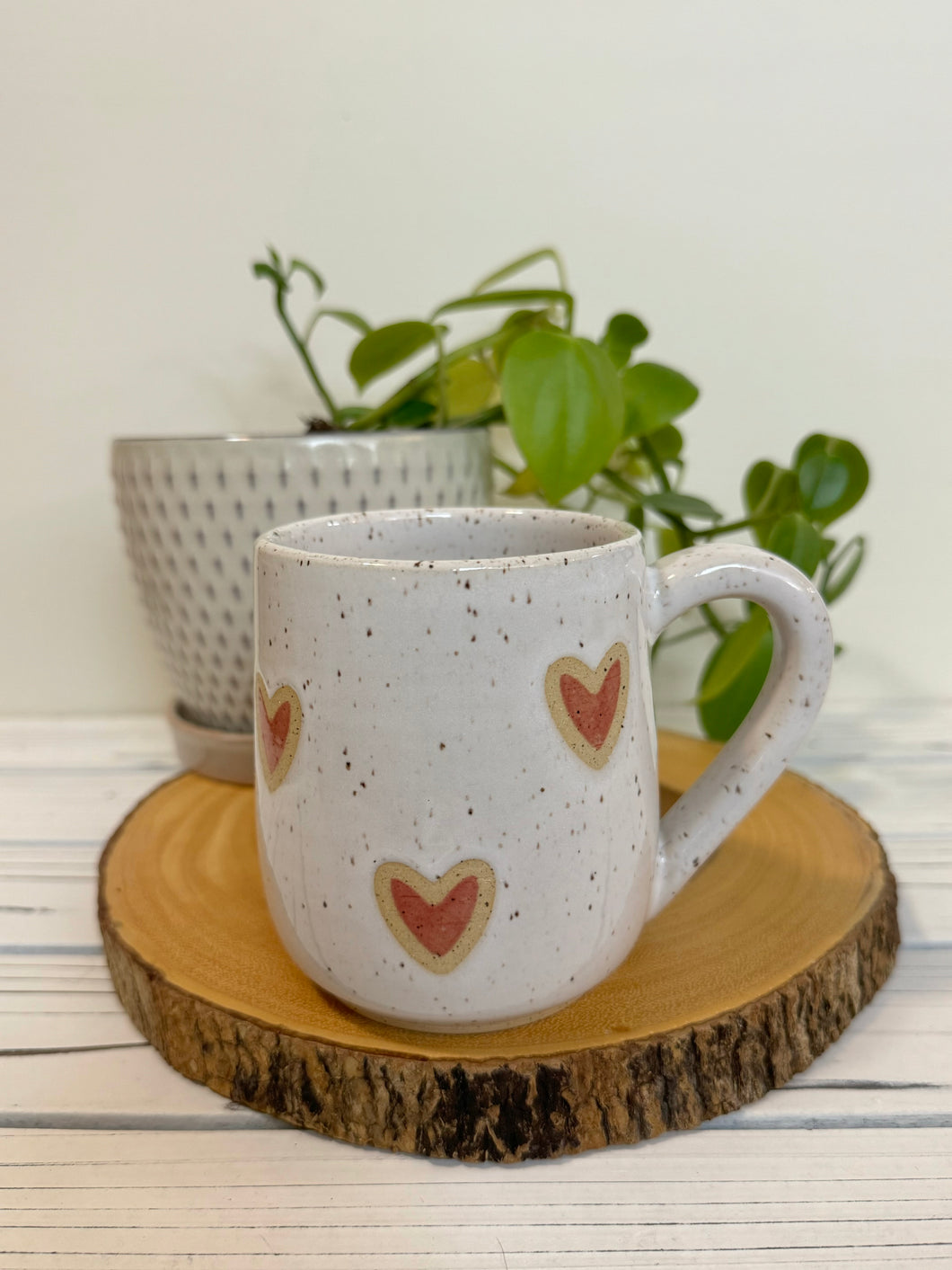 #016 - 16 oz. White speckled mug with red hearts