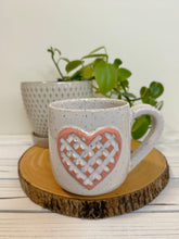 Load image into Gallery viewer, #012 - 16 oz. White speckled mug with a stand out carved matte pink heart *see note
