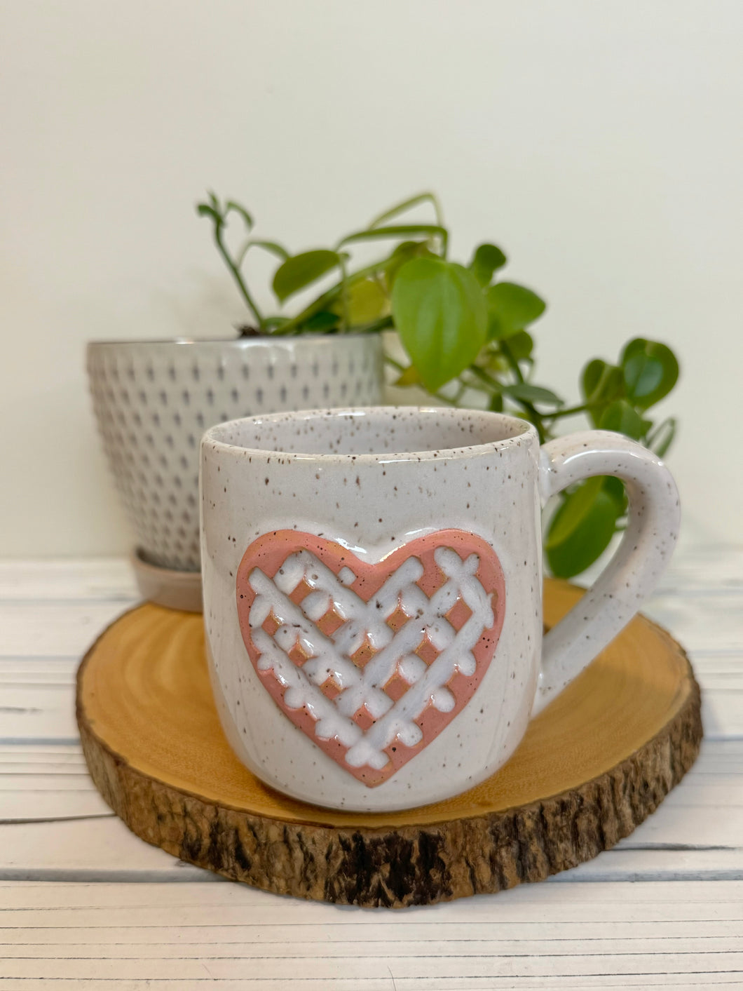 #012 - 16 oz. White speckled mug with a stand out carved matte pink heart *see note