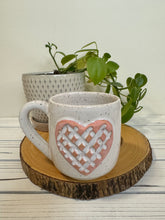 Load image into Gallery viewer, #012 - 16 oz. White speckled mug with a stand out carved matte pink heart *see note
