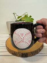 Load image into Gallery viewer, #008 - 16 oz. Black mug with heart pattern on Matte White. Red inside
