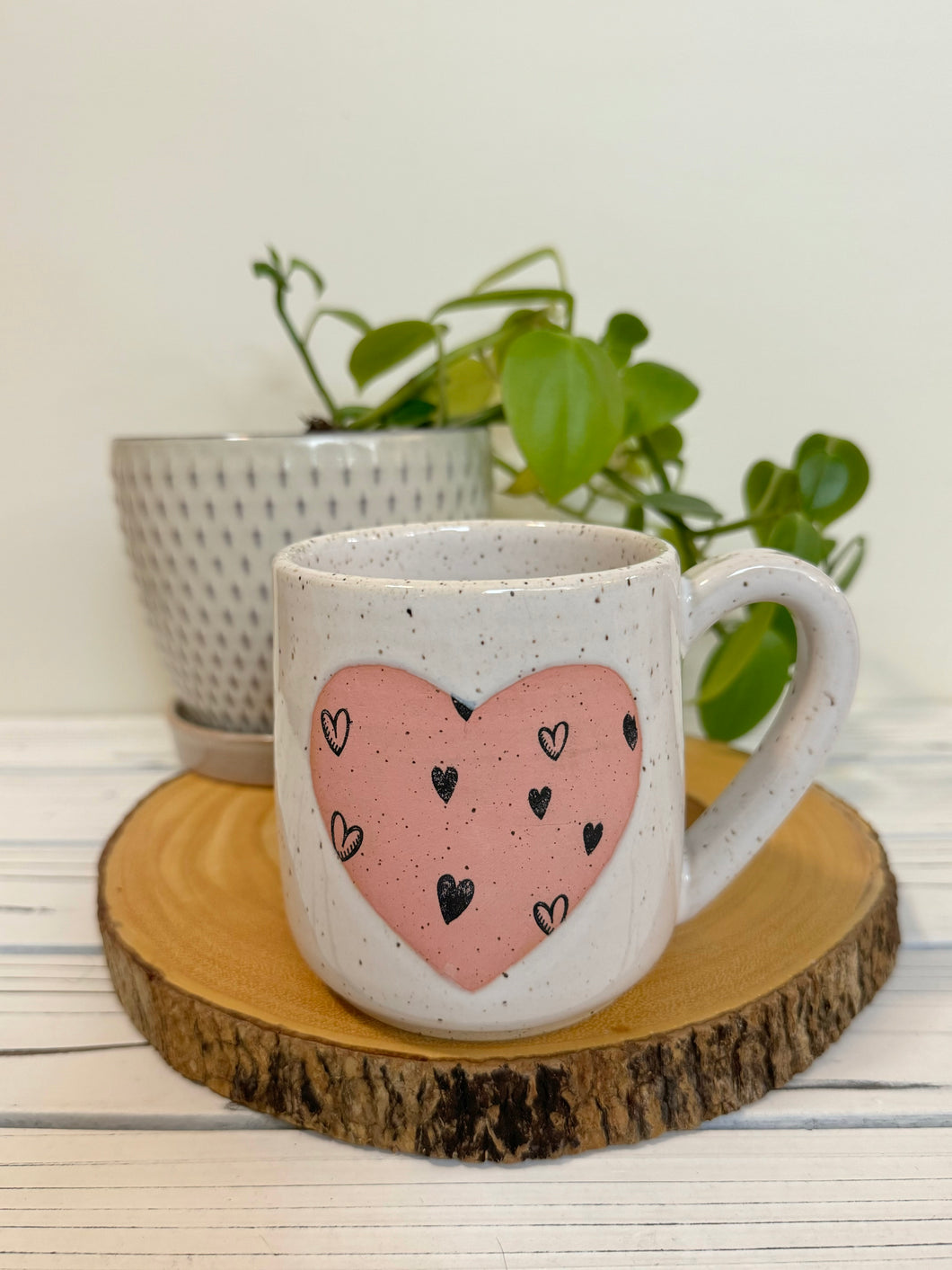 #014 - 16 oz. White speckled mug with heart pattern on matte pink heart