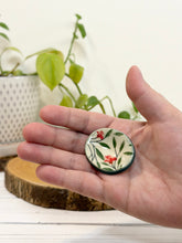 Load image into Gallery viewer, #040 - Red flower patterned Calming stone with green rim
